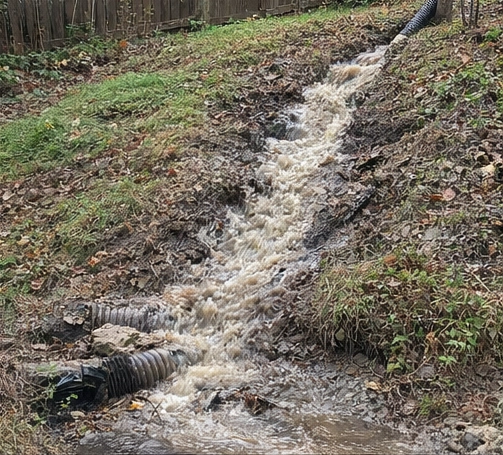 water runoff flowing down hillside causing erosion and drainage issues in Cincinnati Ohio