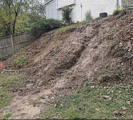 hillside soil erosion with washout and exposed dirt near home in Cincinnati Ohio