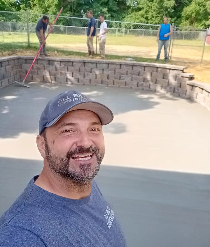 concrete construction crew installing foundation and retaining wall base in Cincinnati