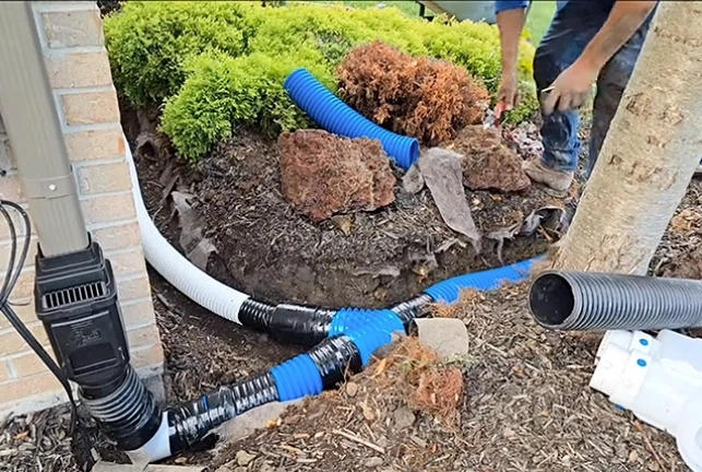 Downspout drainage system installation in Cincinnati Ohio to redirect water away from foundation