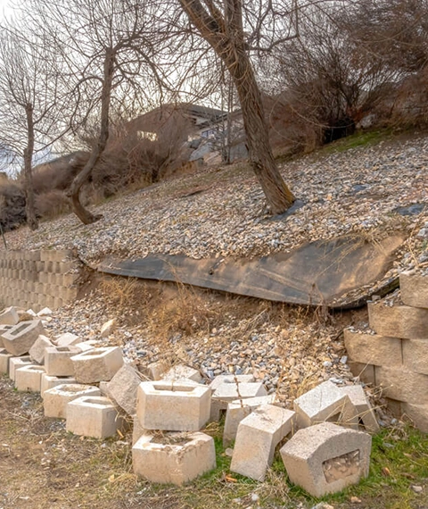 Leaning and cracked retaining wall in Cincinnati showing structural failure